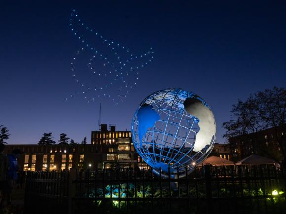 Drones shine in the sky to make the Westfield State University owl mascot