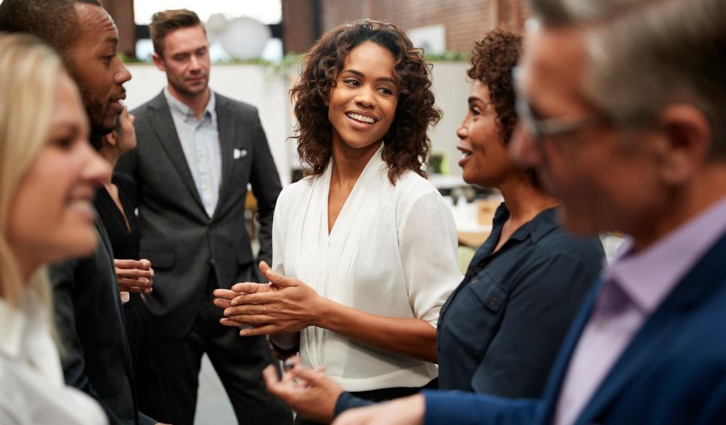 people standing and talking in a group